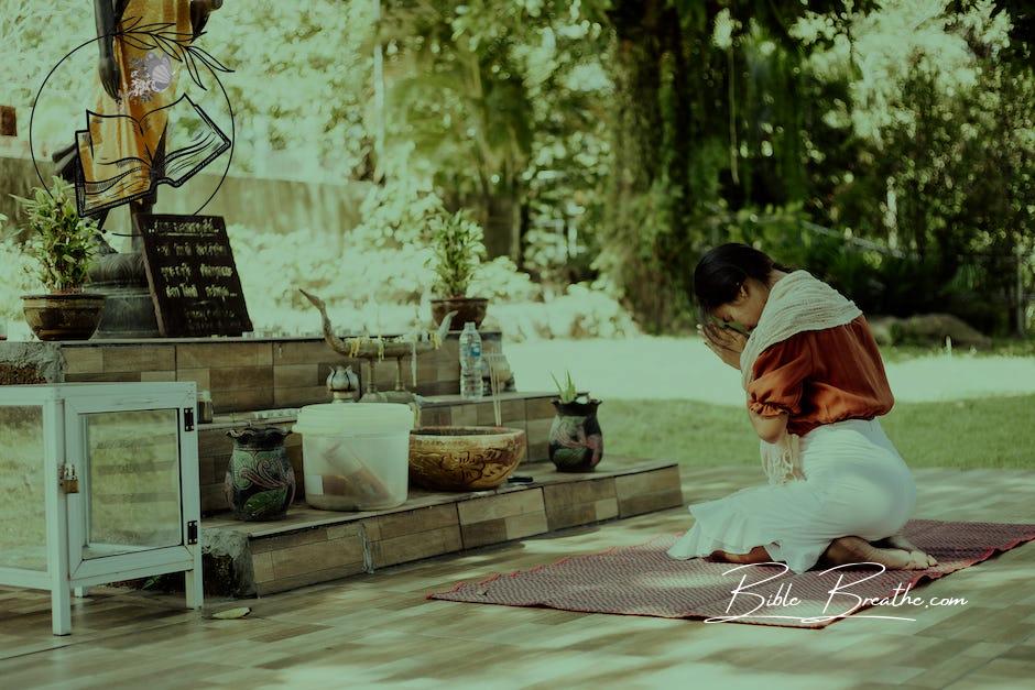 A Woman Kneeling while Praying