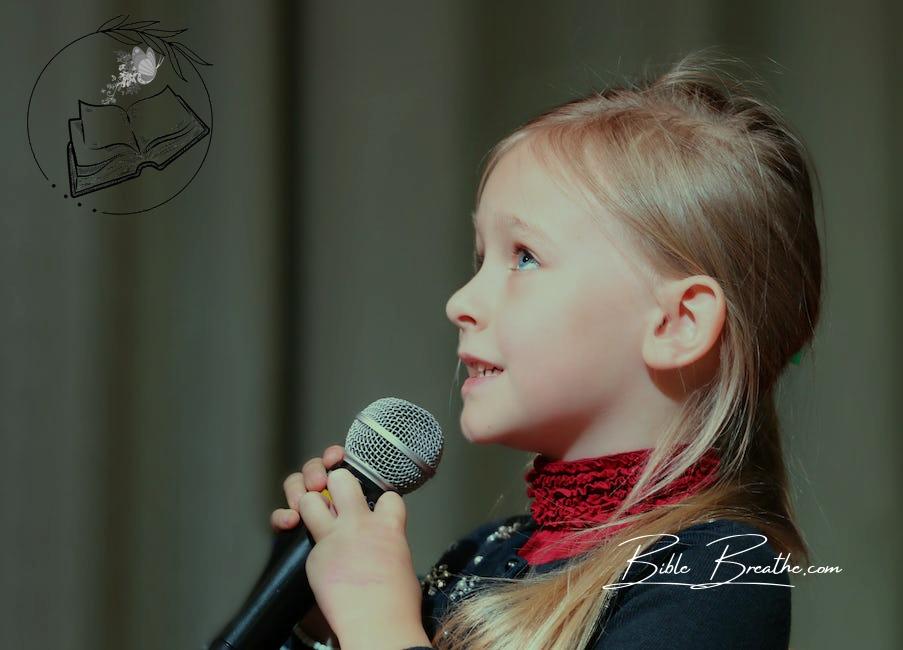 Girl Holding Black Dynamic Microphone While Looking Above