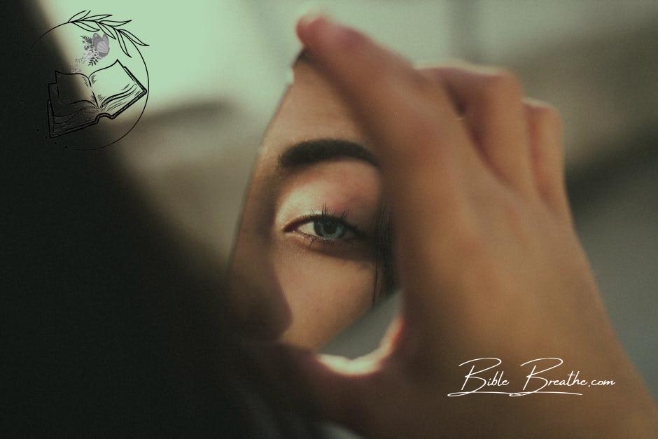 Reflection of Woman's Eye on Broken Mirror