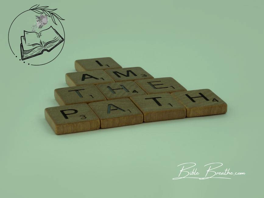 Close-Up Shot of Scrabble Tiles on a White Surface