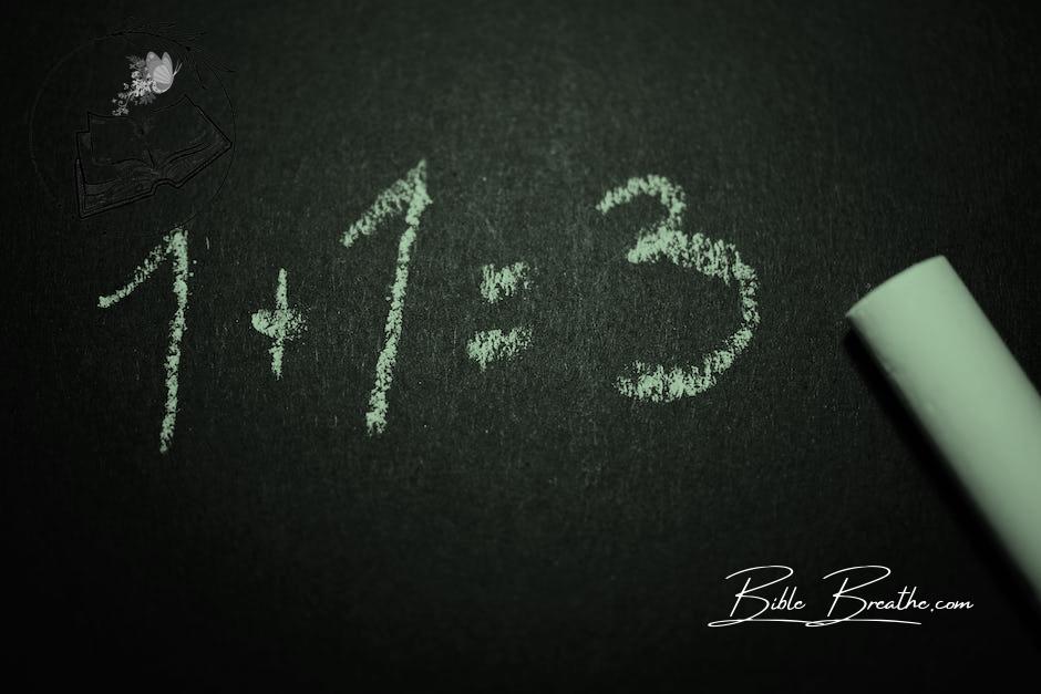 1 + 1 = 3 Text on Black Chalkboard