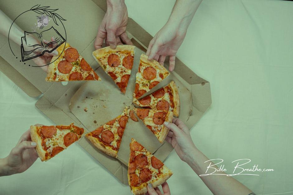 Photo Of People Holding Pizza 