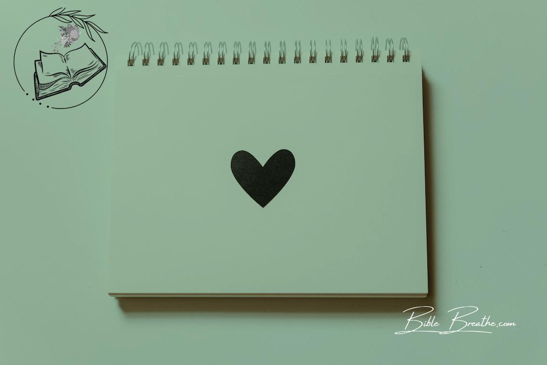 black heart drawn on notebook