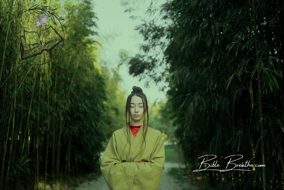 Woman in Green Kimono Standing Near Green Trees