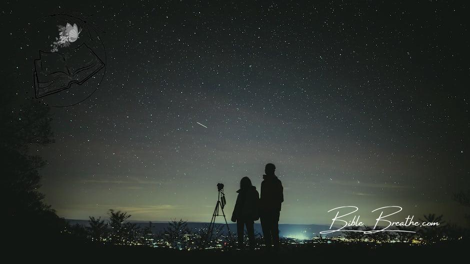 Silhouette of Two Persons Stargazing 