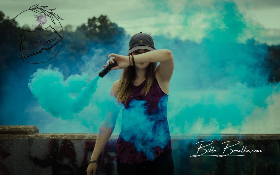 Woman Holding Blue Smoke Flare