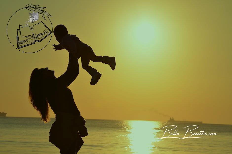 Silhouette Photo of a Mother Carrying Her Baby at Beach during Golden Hour