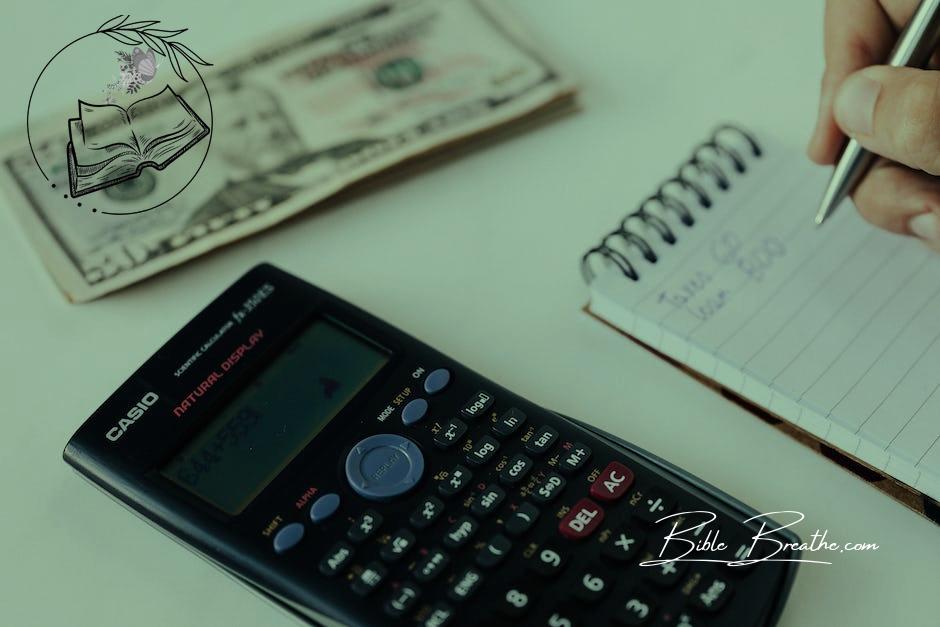 Crop unrecognizable accountant counting savings using notebook and calculator