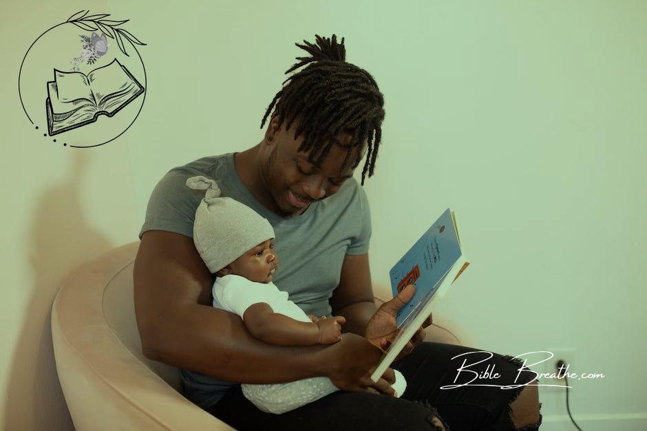 A Father Reading a Book to his Baby