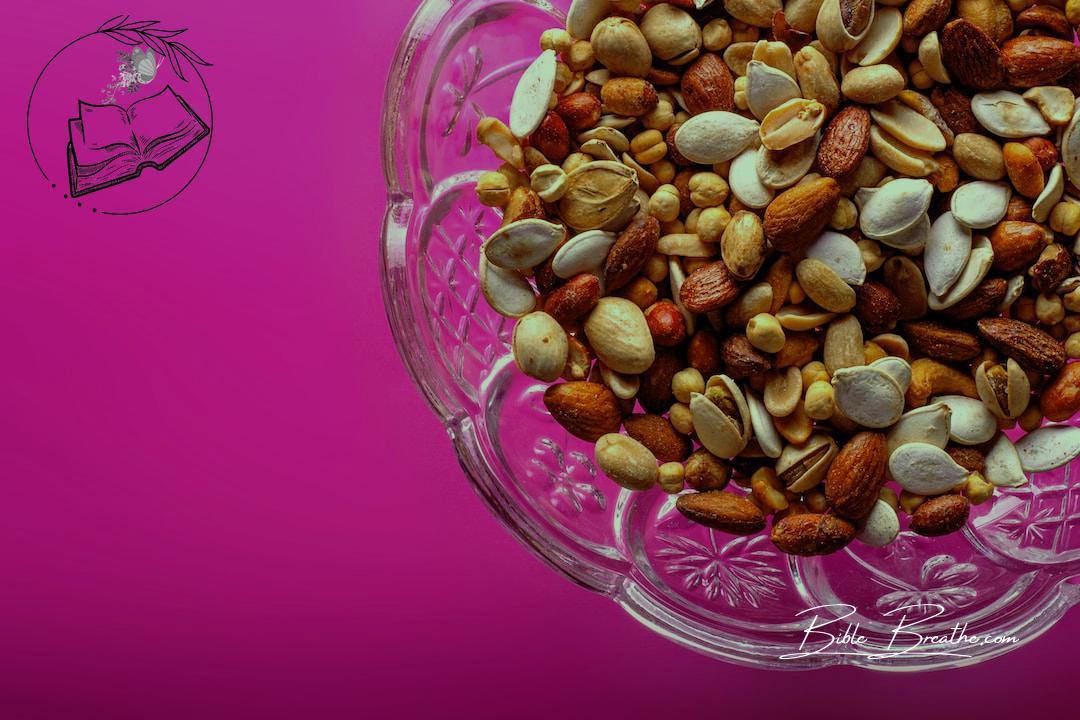 brown almond nuts on clear glass bowl