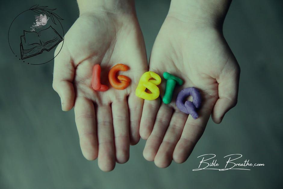 Close-Up Photo of LGBTQ Letters on a Person's Hands