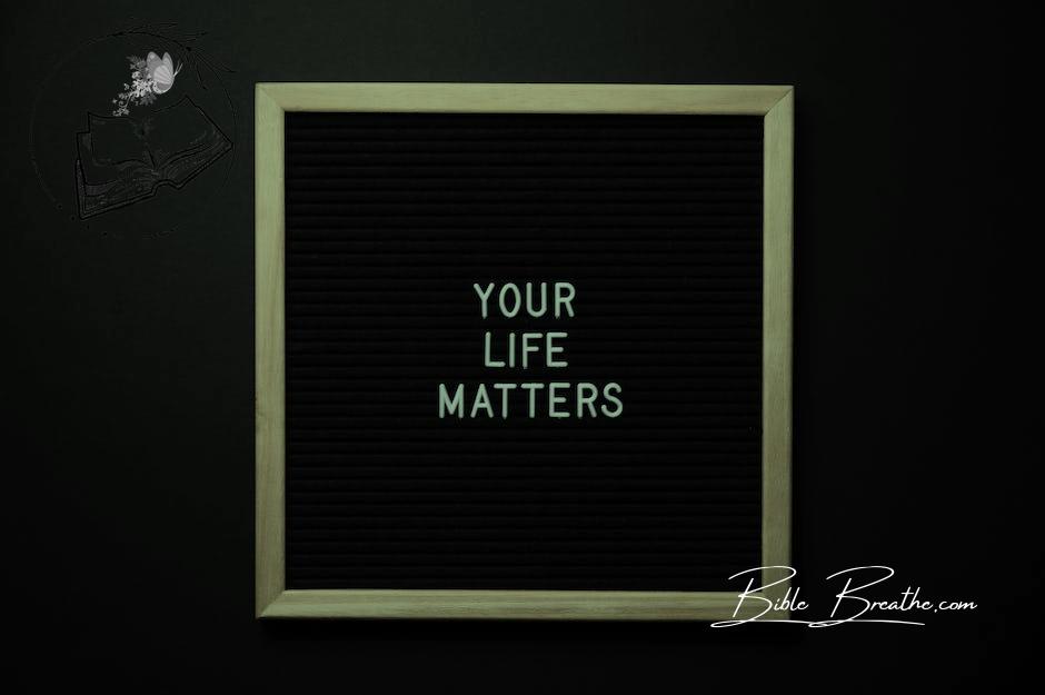 Blackboard with YOUR LIFE MATTERS inscription on black background