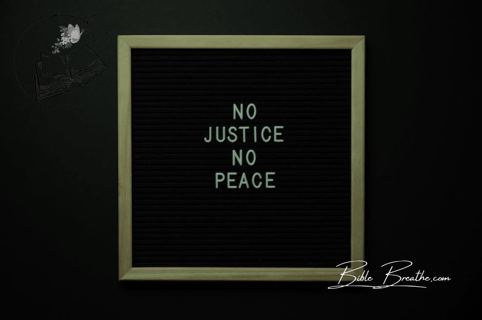 Overhead view of white inscription on center of chalkboard located on black background