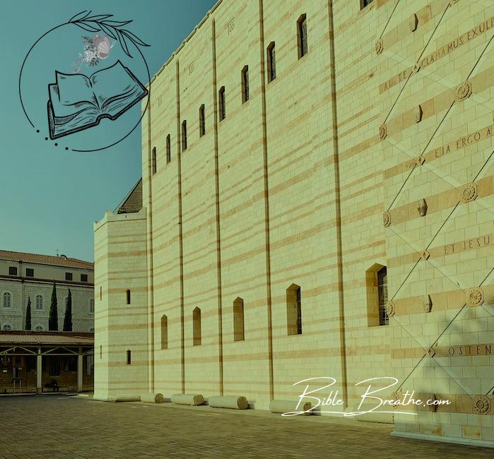 The courtyard of a large building with a clock