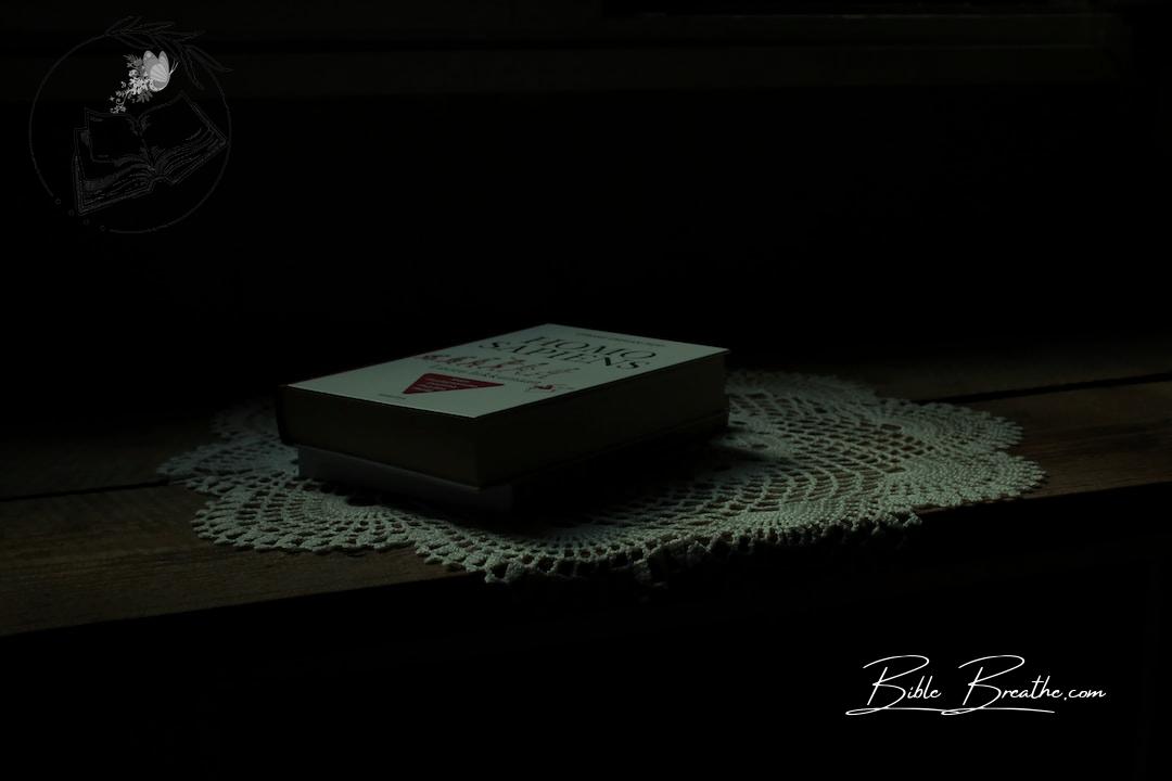white and red marlboro cigarette pack on white table cloth