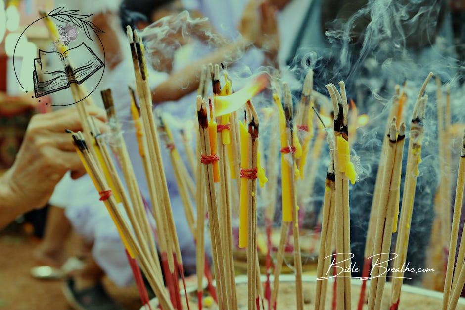 Close-up Photo of Lighted Incense Sticks