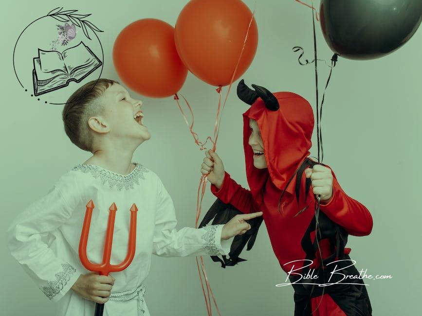 Two Boys in Halloween Costumes Holding Balloons