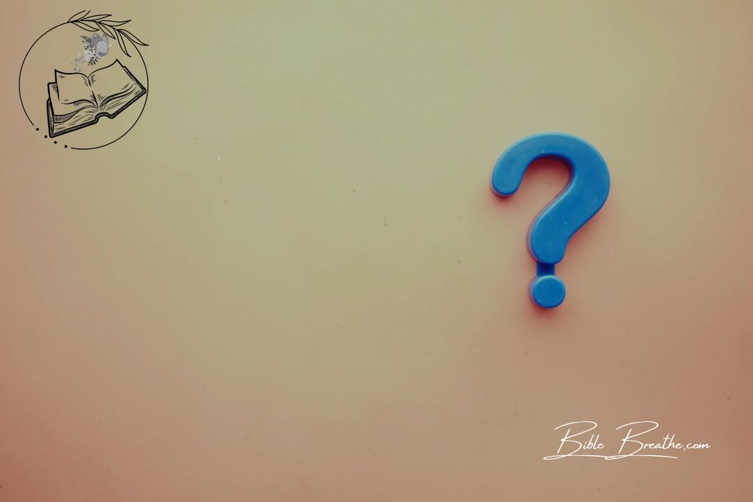 a blue question mark on a pink background