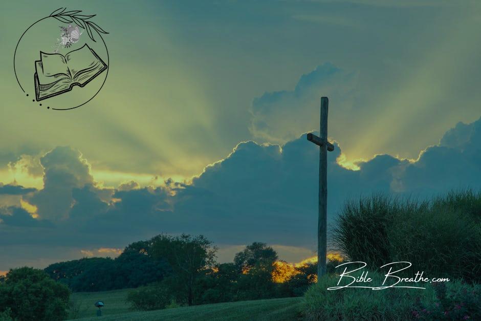 Big Wooden Cross On Green Grass Field Under The White Clouds