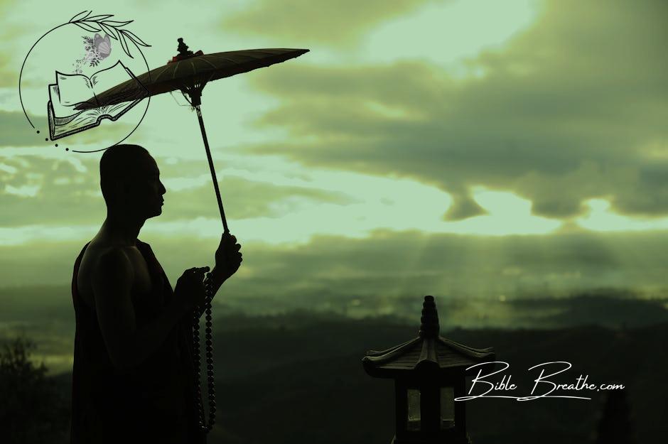 Silhouette Photo of Monk Holding Umbrella