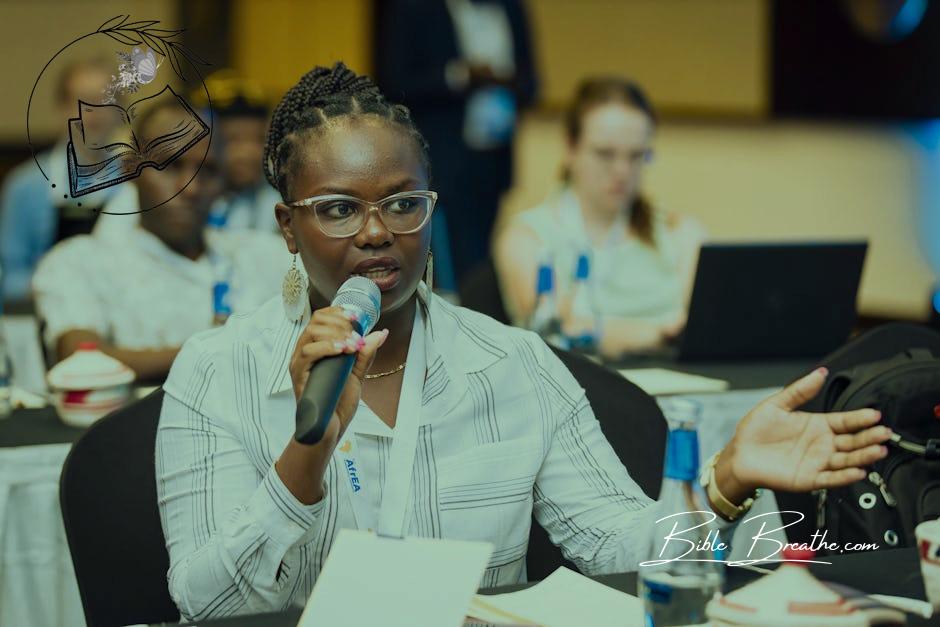 A Woman Speaking at a Conference 