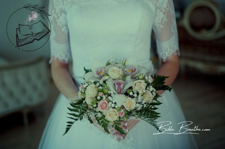 Woman Wearing Wedding Gown Holding Bouquet