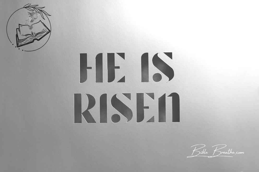 He is risen paper cut words against kraft brown paper
